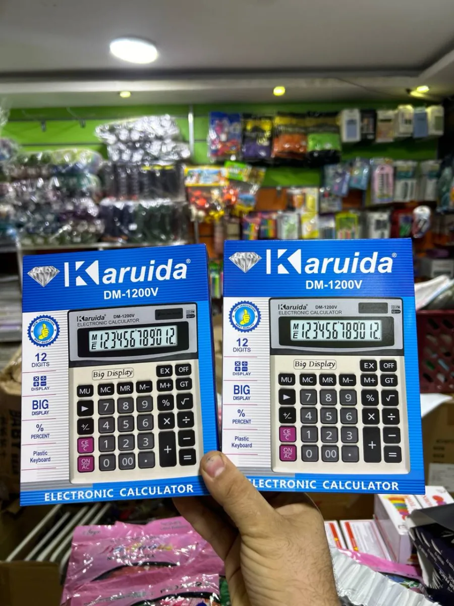 الة حاسبة DM 1200